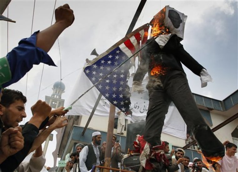 Afghans burn an effigy of Dove World Outreach Center's pastor Terry Jones during a demonstration against the United States in Kabul on Monday. 